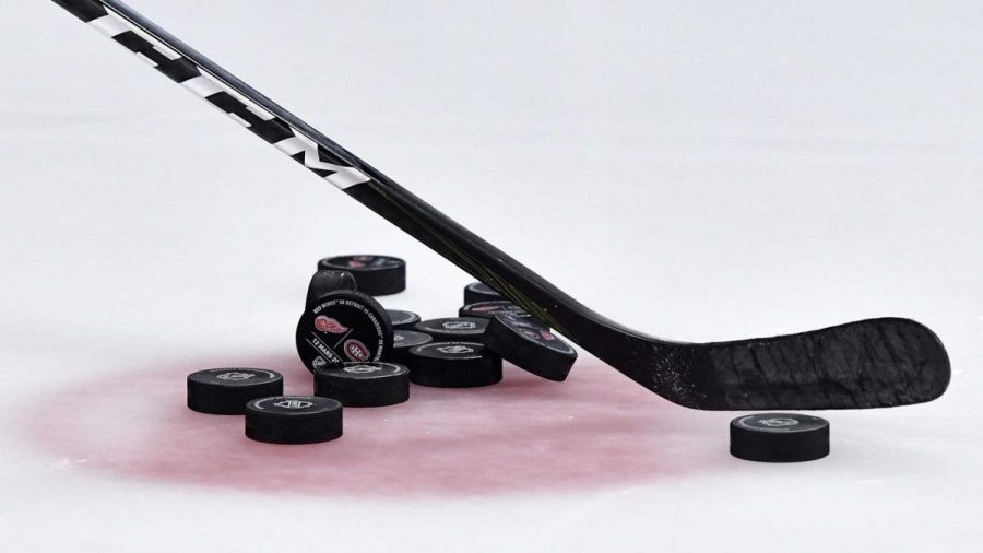 Mar 12, 2019; Montreal, Quebec, CAN; Pucks  and a hockey stick during the warmup period before the game between the Montreal Canadiens and the Detroit Red Wings at the Bell Centre. Mandatory Credit: Eric Bolte-USA TODAY Sports
