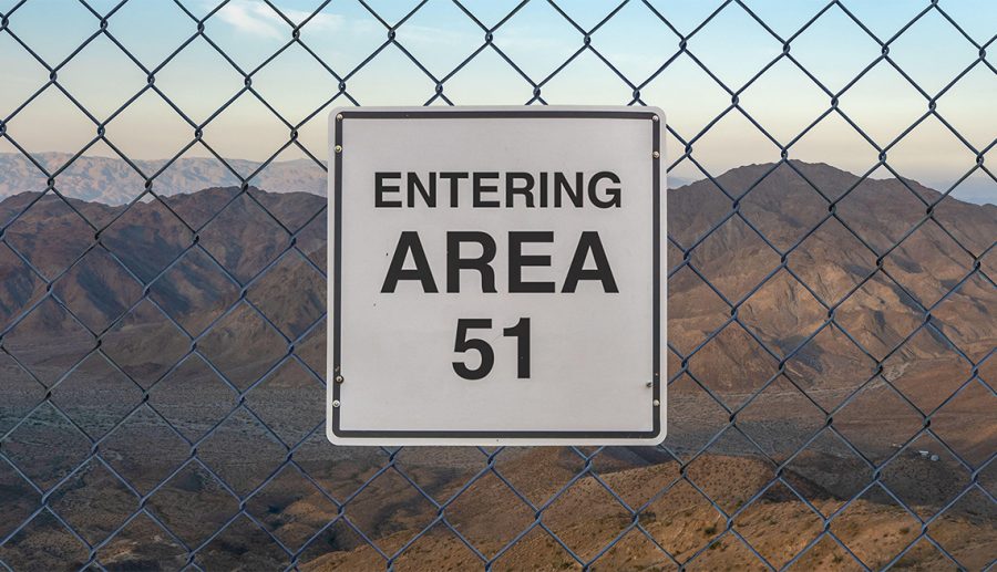 Entering Area 51 sign on a fence at The Military Base in Nevada desert at sunset